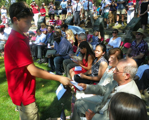  Hawken students passed out flag pins to the new citizens