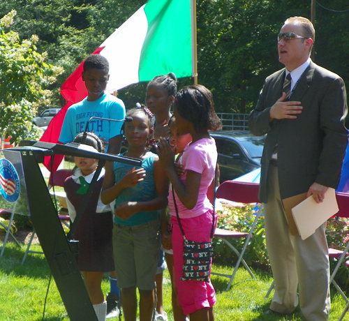 Students from Michael R White Elementary School in Cleveland led the new citizens in the Pledge of Allegiance