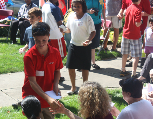  Hawken students passed out flag pins to the new citizens