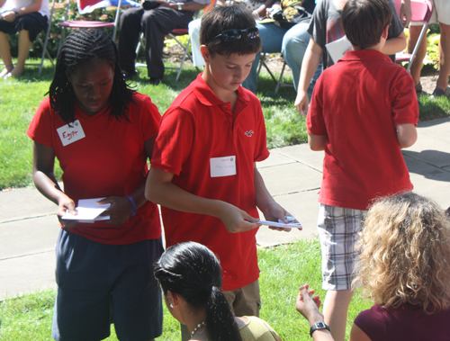  Hawken students passed out flag pins to the new citizens