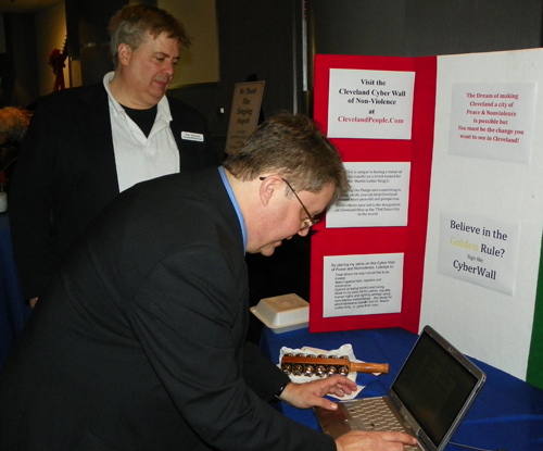 Charles Eversole, Artistic Director of the Singing Angels, signed the Cyber Wall