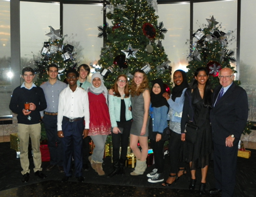 Group of international students in front of Christmas tree