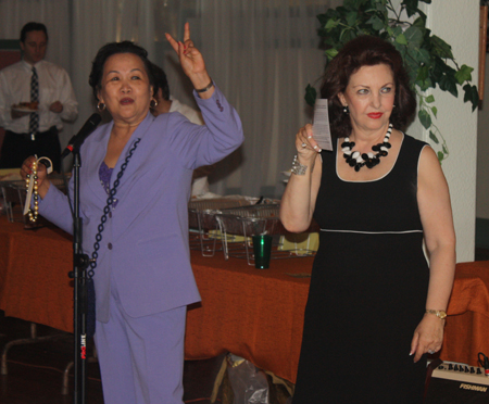 Gia Hoa Ryan and Maria Pujana auctioning