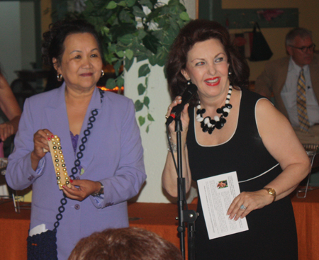 Gia Hoa Ryan and Maria Pujana auctioning