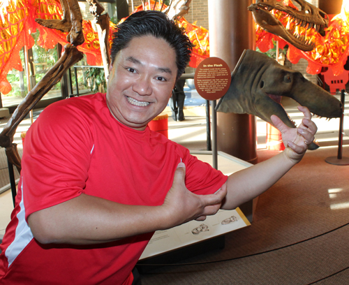 Dragon Dancer Wayne Wong with dinosaurs