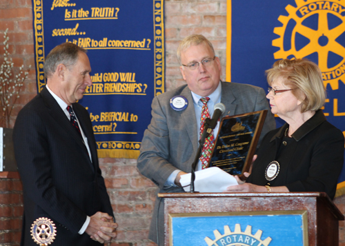 Toby Cosgrove receives award from Paul Qua and Ingrida Bublys