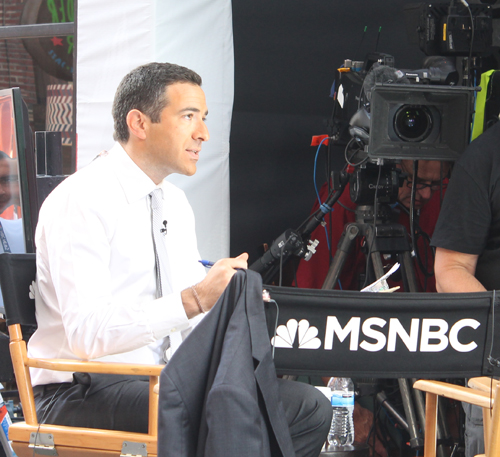 Ari Melber broadcasting live on MSNBC from East 4th Street