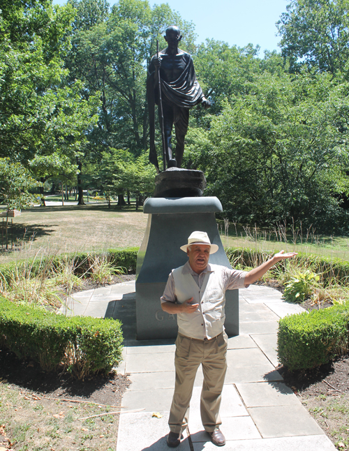 Ray Gehanni in front of statue of Mahatma Gandhi