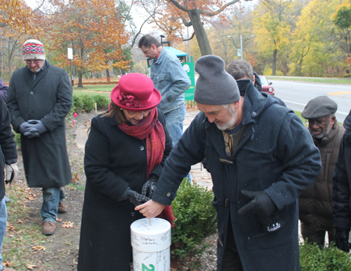 Sheila Crawford and Paul Burik lower the time capsule