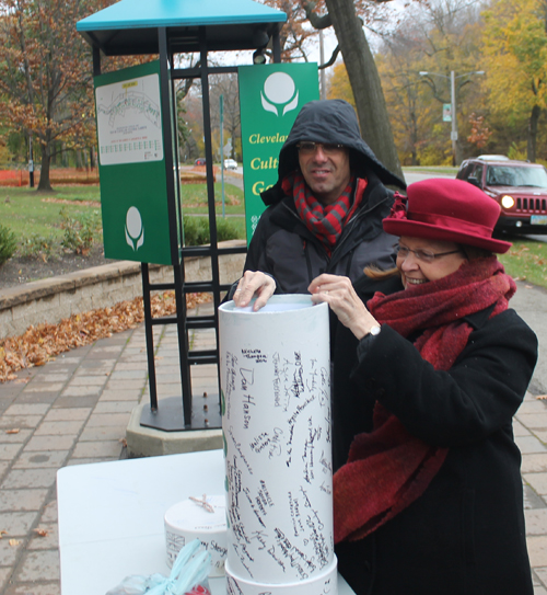 Sheila Crawford placing an item in the time capsule