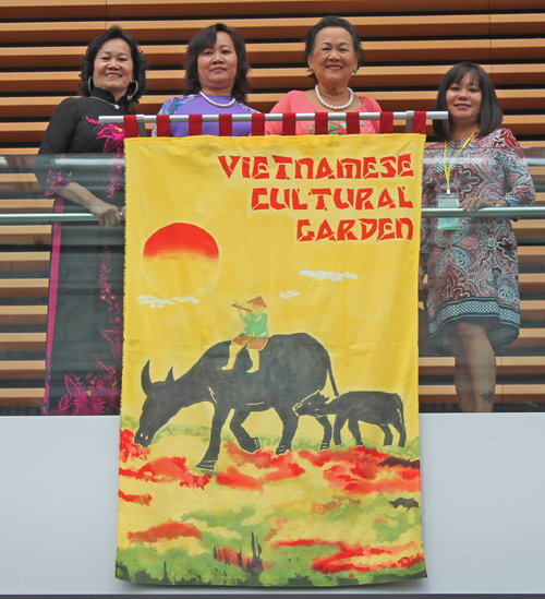 Vietnamese ladies with Cultural Garden banner