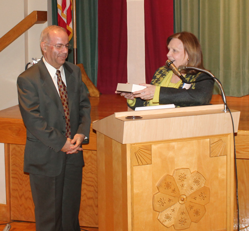 Sheila Crawford presents gavel to Wael Khoury