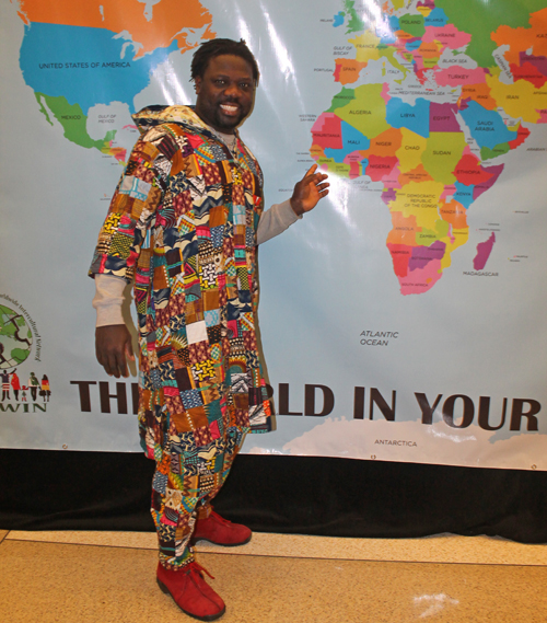 Posing with a map of Guinea