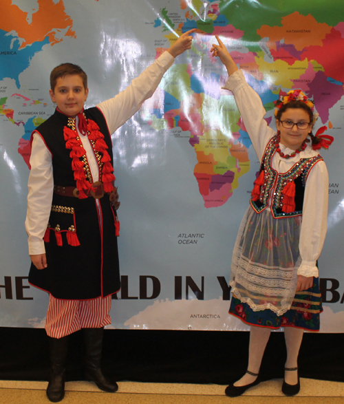 Gustav Kotlarsic and Amelia Kotlarsic Posing with a map of Poland