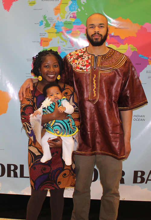 Damon Wilson, Niza Phiri and their Baby Princess Sophia Posing with map of Zambia