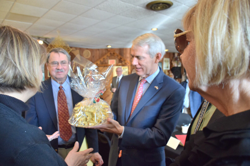 US Senator Rob Portman with a Sakotis (Lithuanina tree cake)