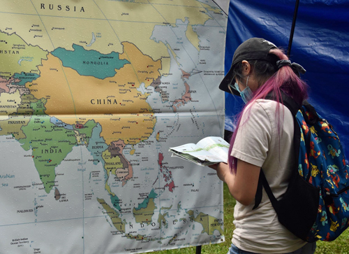 Studying the map of China at One World Day