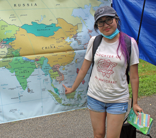 Girl pointing at ClevelandPeople.com map of Asia