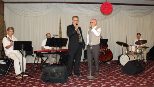 Ralph Perk Jr. singing with the band