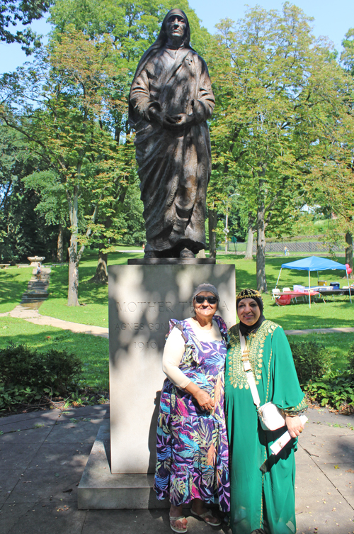 Posing with Mother Teresa statue in the Albanian Garden