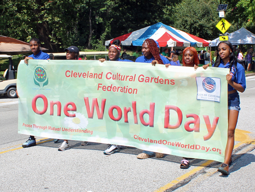 students from the CMSD John F Kennedy High School ROTC carrying the One World Day banner