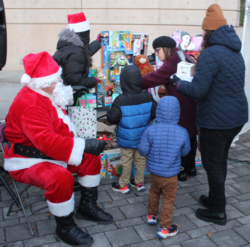 Kids with toys and Santa