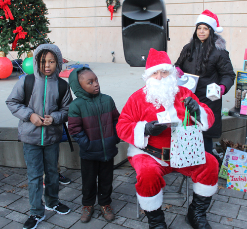 Kids with toys and Santa