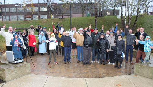 Rotary Club of Cleveland giving the peace sign