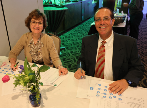 Paula Tilisky and Samy Tanious working the checkin table