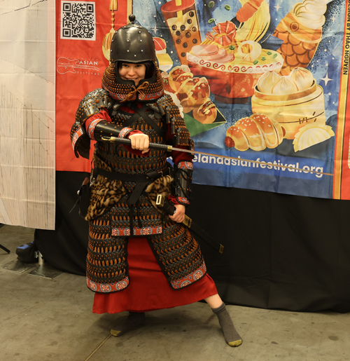 Trying on armor at Silk Road Cultural Collective at 2026 Cleveland Fan Expo