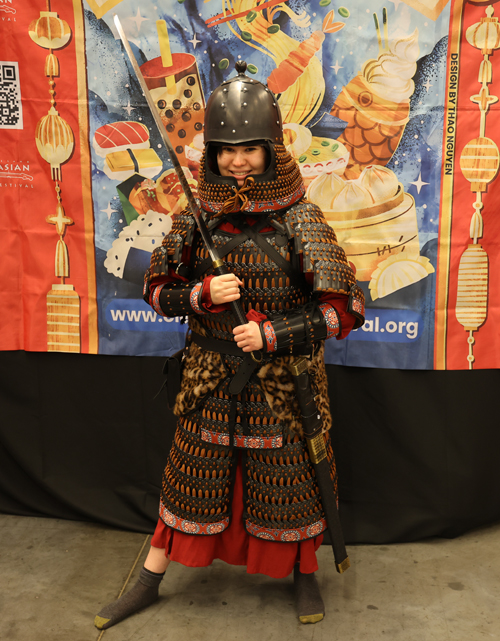 Trying on armor at Silk Road Cultural Collective at 2026 Cleveland Fan Expo