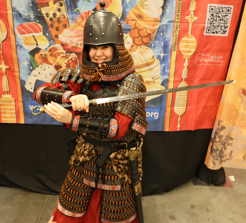 Trying on armor at Silk Road Cultural Collective at 2026 Cleveland Fan Expo