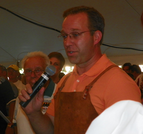 Meteorologist Scott Sabol of Fox 8 TV Cleveland taps the keg at Oktoberfest