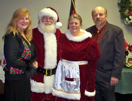 Renate and David Jakupca flank Santa and Mrs Claus at the 2009 GABA Christmas party