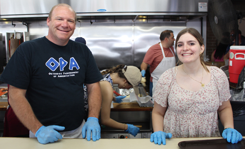 Greek man and girl volunteer