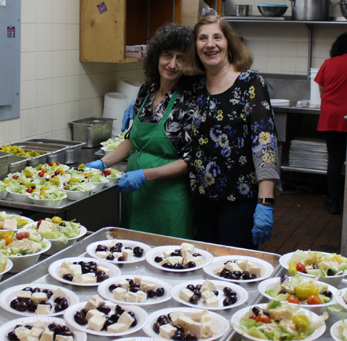 Volunteers serving food
