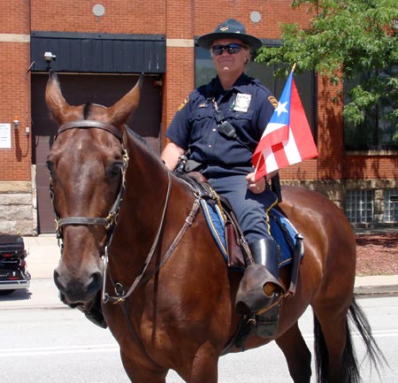 Cleveland Police on horse with Puerto Rican flag