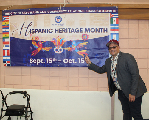 Chris Martinez with Hispanic Heritage banner