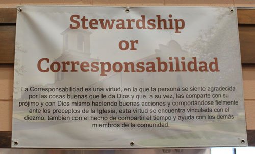 Iglesia La Sagrada Familia Stewardship sign in Spanish