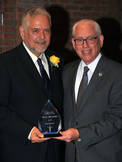 Councilman Mike Polensek gives Joe Valencic his CIHF award