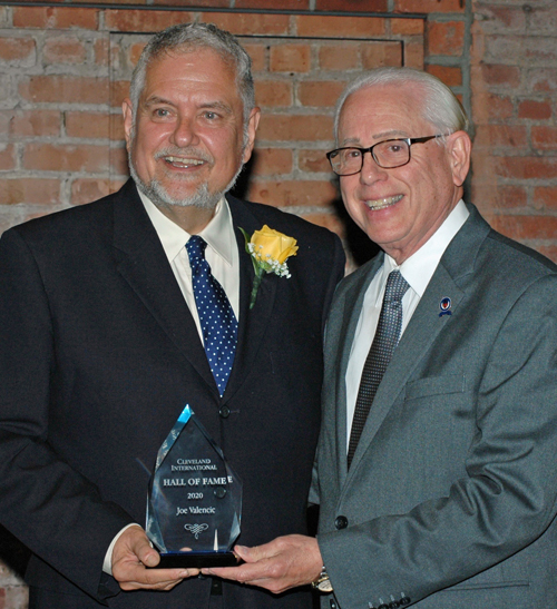 Councilman Mike Polensek gives Joe Valencic his CIHF award