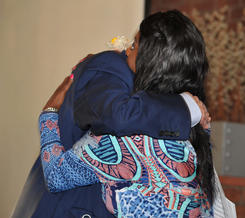 Albert Ratner hugs Valarie McCall