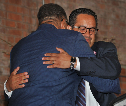 Dr. Alex Johnson hugging Victor Ruiz