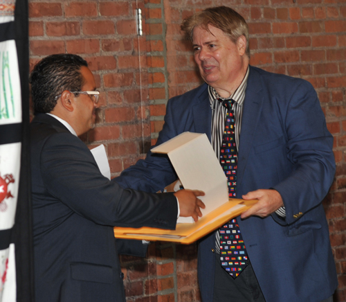 Victor Ruiz receiving proclamations from Dan Hanson