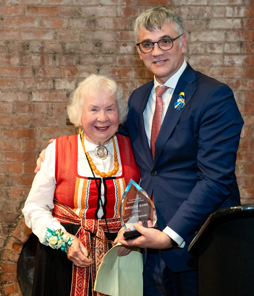 Erika Puussaar receives award from Estonian Ambassador Kristjan Prikk