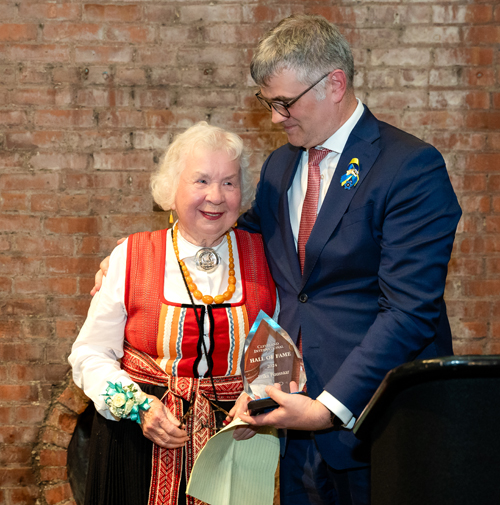 Erika Puussaar receives award from Estonian Ambassador Kristjan Prikk