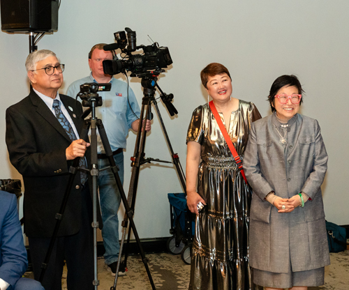 Anjan Ghose, Dan Monroe, Ying Pu and Margaret Wong watching Johnny Wu speak