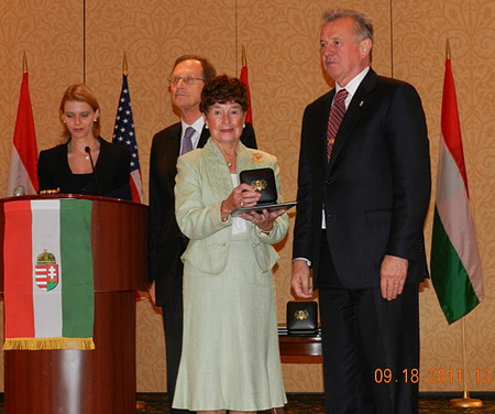 Jeanette Grasselli Brown accepts the President's Medal Of Merit from Hungarian President Pál Schmitt 