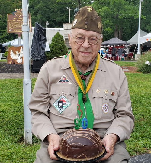 older scout with cake at Hungarian Scout Festival