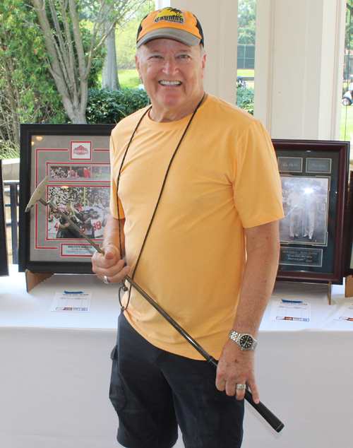 Greg Polyak in front of some auction items